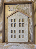 Neutral welcome wall hanging by We are the Branches featuring a shadow box art design with multimedia elements for wall decor.